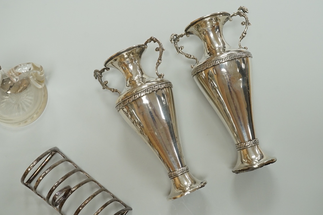 A pair of Edwardian silver mounted whisky noggins by J & J Maxfield Ltd, Birmingham, 1908, one damaged and a pair of matching silver 'Whisky' wine labels, together with a pair of late Victorian silver posy vases by Willi